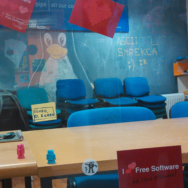 hackerspace with #ilovefs posters, postcard, robot saying Romeo, oh Romeo